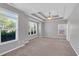 Spacious bedroom with tray ceiling, ceiling fan, large windows offering abundant natural light at 903 Duncan Ter, Canton, GA 30115