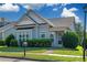 Inviting blue home with lush green lawn, mature hedges, and a quaint covered entryway at 903 Duncan Ter, Canton, GA 30115