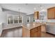 Functional kitchen featuring a breakfast nook, wooden cabinets, and stainless steel dishwasher at 903 Duncan Ter, Canton, GA 30115