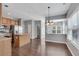 Well-lit kitchen with stainless steel appliances, an island, and sleek dark hardwood floors at 903 Duncan Ter, Canton, GA 30115