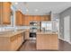 Functional kitchen with ample wooden cabinetry, stainless steel appliances, and a center island at 903 Duncan Ter, Canton, GA 30115