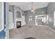 Spacious living room with built-in shelving, a cozy fireplace, and expansive windows at 903 Duncan Ter, Canton, GA 30115