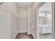 Walk-in closet providing ample storage with built-in shelving and convenient access to bathroom at 903 Duncan Ter, Canton, GA 30115