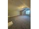 Large attic space with vaulted ceilings and neutral carpet at 12 Barrington Ct, Sharpsburg, GA 30277