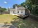 Backyard with grass and white exterior of house at 12 Barrington Ct, Sharpsburg, GA 30277