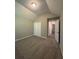 Bedroom with vaulted ceiling and view of hallway at 12 Barrington Ct, Sharpsburg, GA 30277