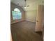 Bedroom with vaulted ceiling, large window, and neutral carpet at 12 Barrington Ct, Sharpsburg, GA 30277