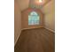 Bedroom with vaulted ceiling, large window, and neutral carpet at 12 Barrington Ct, Sharpsburg, GA 30277