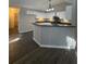 Beautiful kitchen with white cabinets, a breakfast bar, and modern lighting at 12 Barrington Ct, Sharpsburg, GA 30277