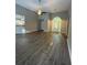 Bright living room featuring vaulted ceiling, ceiling fan and modern hardwood floors at 12 Barrington Ct, Sharpsburg, GA 30277