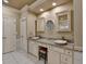 Bright bathroom featuring double sinks with granite countertops and ample storage at 1595 Northcliff Trce, Roswell, GA 30076