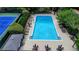 An aerial view of the rectangular community pool with a fenced perimeter and plenty of lounge chairs at 1595 Northcliff Trce, Roswell, GA 30076