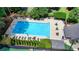 A stunning aerial view of the community pool with a large deck and plenty of seating at 1595 Northcliff Trce, Roswell, GA 30076