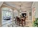 Dining area with stylish table, chairs, and views of the kitchen and sunroom at 1595 Northcliff Trce, Roswell, GA 30076