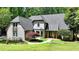 Charming home with lush landscaping, and a welcoming entrance for instant curb appeal at 1595 Northcliff Trce, Roswell, GA 30076