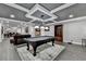 Game room features a pool table, game table, decorative ceiling, recessed lights and laminate flooring at 1595 Northcliff Trce, Roswell, GA 30076