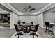 Spacious game room features a modern ceiling fan, hardwood floors, and octagonal poker table with seating for four at 1595 Northcliff Trce, Roswell, GA 30076