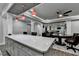 Open-concept with kitchen island, bar seating and adjacent dinette set, with an open layout at 1595 Northcliff Trce, Roswell, GA 30076