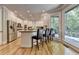 Bright kitchen with stainless steel appliances, island with seating, and hardwood floors, offering a modern and functional space at 1595 Northcliff Trce, Roswell, GA 30076