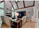 Bright living room with vaulted ceiling, brick fireplace, and comfortable seating area at 1595 Northcliff Trce, Roswell, GA 30076