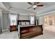 Spacious main bedroom boasts trey ceilings, view of en suite bath, and natural light at 1595 Northcliff Trce, Roswell, GA 30076
