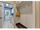 Organized mudroom with built-in storage, hooks, and bench, leading to a laundry area with a door to the exterior at 1595 Northcliff Trce, Roswell, GA 30076