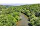 Beautiful aerial view of the river winding through a dense forest of trees at 1595 Northcliff Trce, Roswell, GA 30076