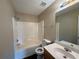 Standard bathroom with shower and tub combo with dark wood vinyl flooring and a single sink at 425 Bell Flower Trl, Locust Grove, GA 30248