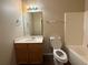 Bathroom with a vanity, a mirror, and a shower-tub combination at 425 Bell Flower Trl, Locust Grove, GA 30248