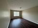 Bedroom featuring wood floors, natural light, and neutral walls at 425 Bell Flower Trl, Locust Grove, GA 30248