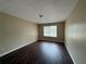 Bedroom featuring wood floors, natural light, and neutral walls at 425 Bell Flower Trl, Locust Grove, GA 30248