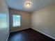 Bedroom with wood floors, neutral walls, and ample natural light at 425 Bell Flower Trl, Locust Grove, GA 30248