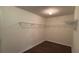 Decent sized walk-in closet with wood-look vinyl flooring and a wire rack and rail shelving system at 425 Bell Flower Trl, Locust Grove, GA 30248
