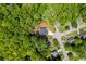 Aerial view of the house surrounded by lush trees in a residential neighborhood at 632 Hunters Cove Ln, Loganville, GA 30052