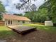 View of a backyard with a large deck and storage shed surrounded by a fence at 106 Kimbell Farm Dr, Locust Grove, GA 30248
