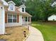 The home features manicured landscaping, a sidewalk leading to the entryway, and dormer windows at 106 Kimbell Farm Dr, Locust Grove, GA 30248