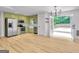 Bright, open kitchen with stainless appliances, light green cabinets and easy access to the outdoor deck at 106 Kimbell Farm Dr, Locust Grove, GA 30248