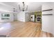 Bright living area featuring hardwood floors and open access to the stylish kitchen at 106 Kimbell Farm Dr, Locust Grove, GA 30248