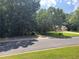 View of empty lot surrounded by trees at 106 Kimbell Farm Dr, Locust Grove, GA 30248