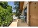 This unit features a private balcony with chairs, table, and tree top views at 1225 Church St # M, Decatur, GA 30030