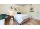 Cozy bedroom features natural light, three botanical prints, and a comfortable chair at 1225 Church St # M, Decatur, GA 30030
