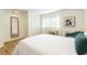 Bright bedroom features hardwood floors, a large window, and white walls providing a modern feel at 1225 Church St # M, Decatur, GA 30030