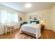 Bright bedroom with hardwood floors, neutral tones, a writing desk and natural light at 1225 Church St # M, Decatur, GA 30030