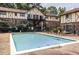 Large community swimming pool with lounge chairs at 1225 Church St # M, Decatur, GA 30030