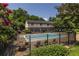 An inviting community pool with mature trees and landscaping at 1225 Church St # M, Decatur, GA 30030