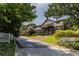 This exterior features an immaculate lawn with two condo signs at 1225 Church St # M, Decatur, GA 30030