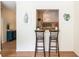 Kitchen pass-through with breakfast bar seating area provides an eat-in casual option at 1225 Church St # M, Decatur, GA 30030