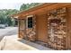 Exterior view of the community laundry room entrance featuring brick, new windows and doors at 1225 Church St # M, Decatur, GA 30030