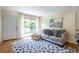 Bright living room features stylish furniture and direct access to a private balcony at 1225 Church St # M, Decatur, GA 30030