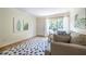Bright living room area with hardwood flooring and a sliding door that leads to a private balcony at 1225 Church St # M, Decatur, GA 30030